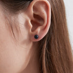 Blue Sandstone Stud Earrings on ear