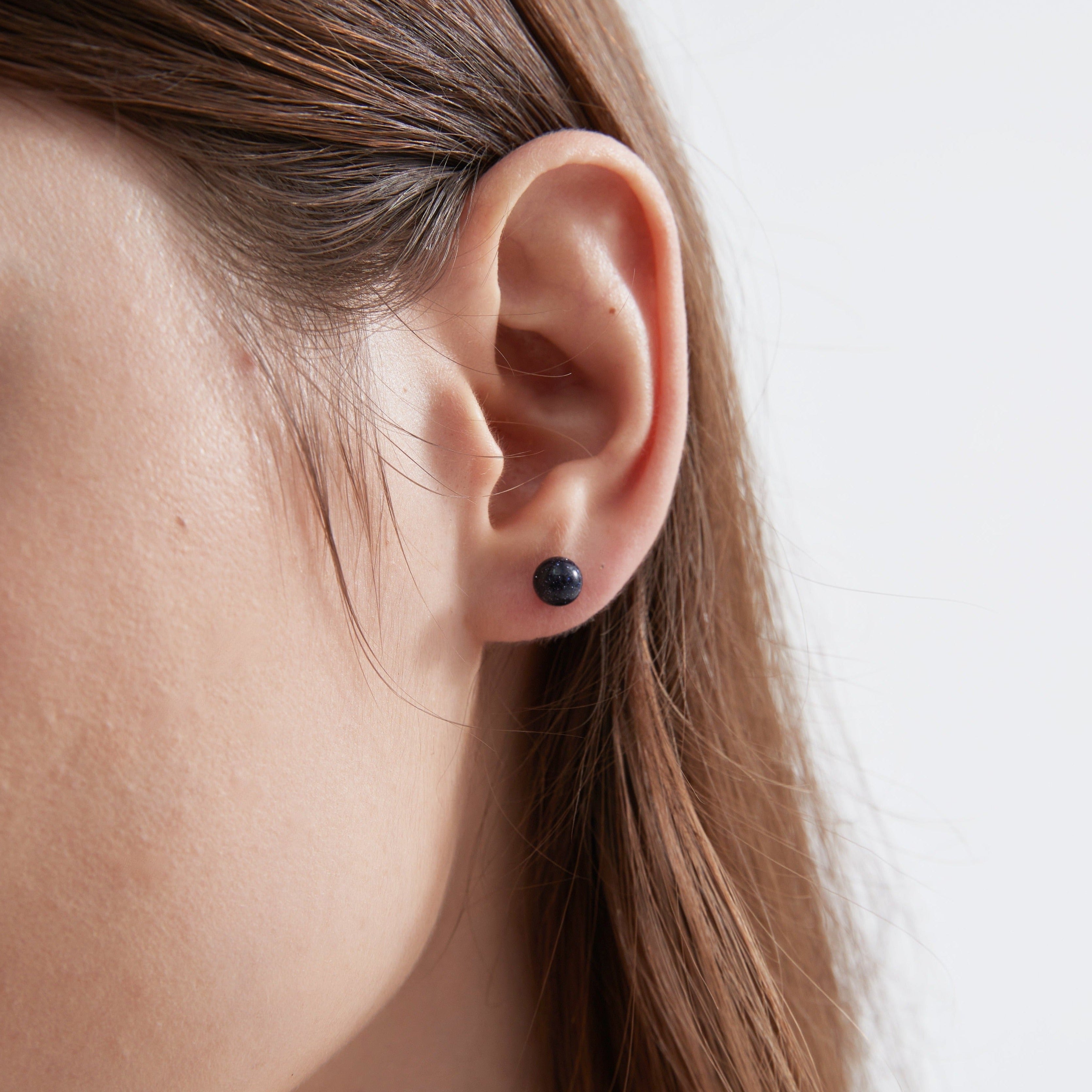 Blue Sandstone Stud Earrings on ear