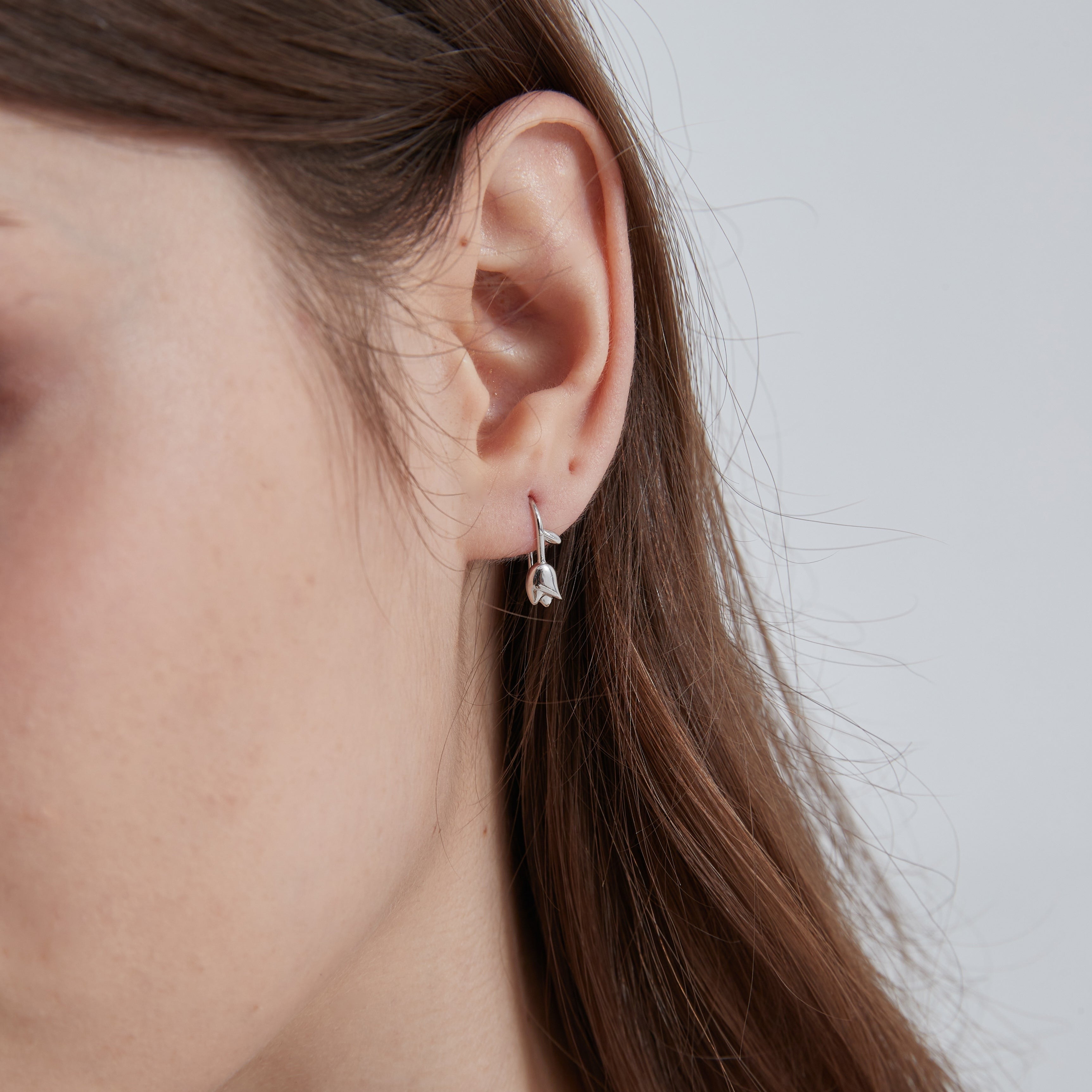 STMG Tiny Tulip Hook Earrings on ear