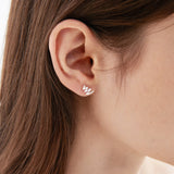 STMG Minimalist Wave Stud Earrings on ear