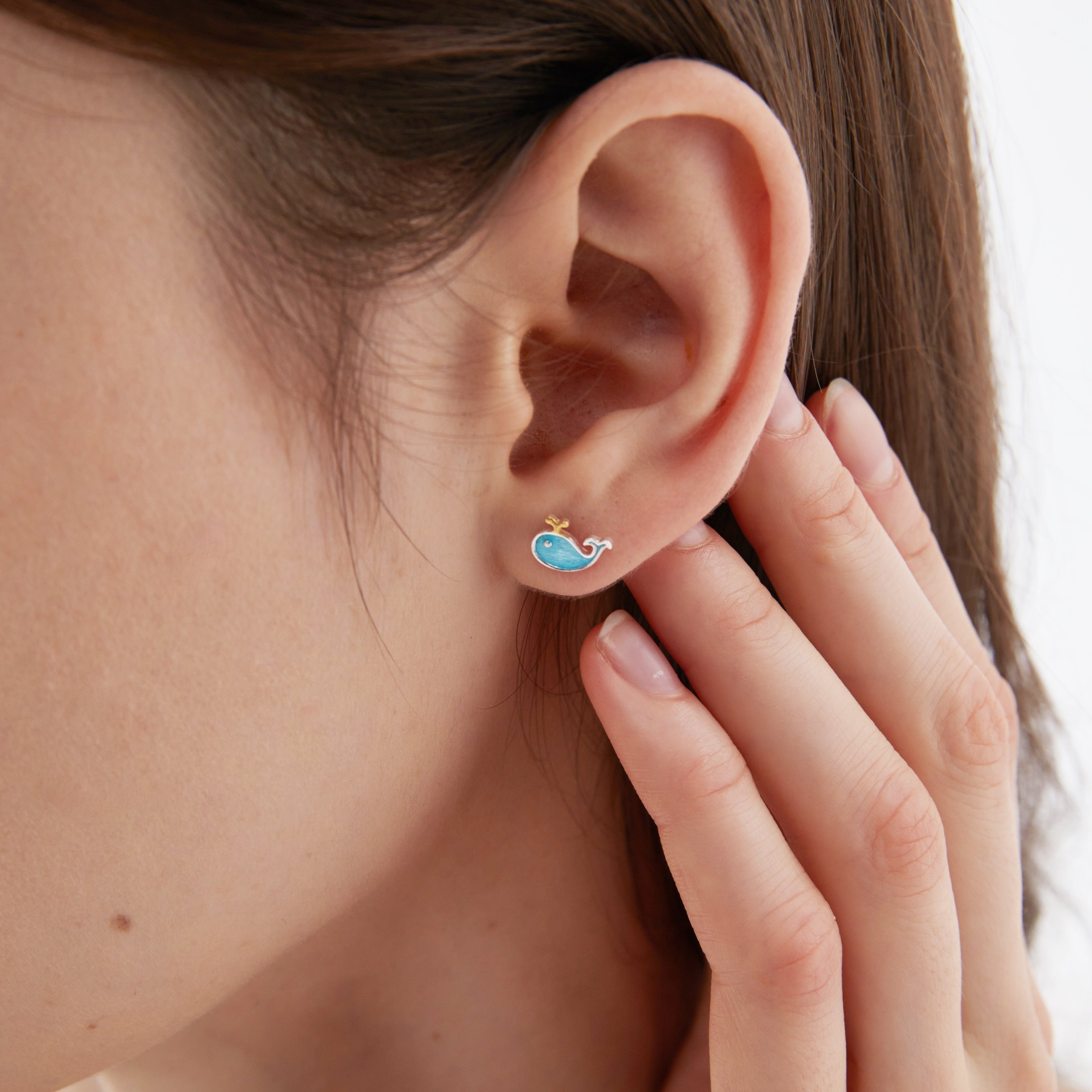 Baby Whale Stud Earrings on ear