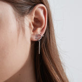 Asymmetric Feather Dangle Earrings on ear