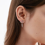 Asymmetric Feather Dangle Earrings on ear