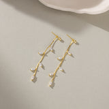 STMG Leaf Dangle Earrings in gold