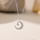 STMG Star on Crescent Moon Necklace in silver