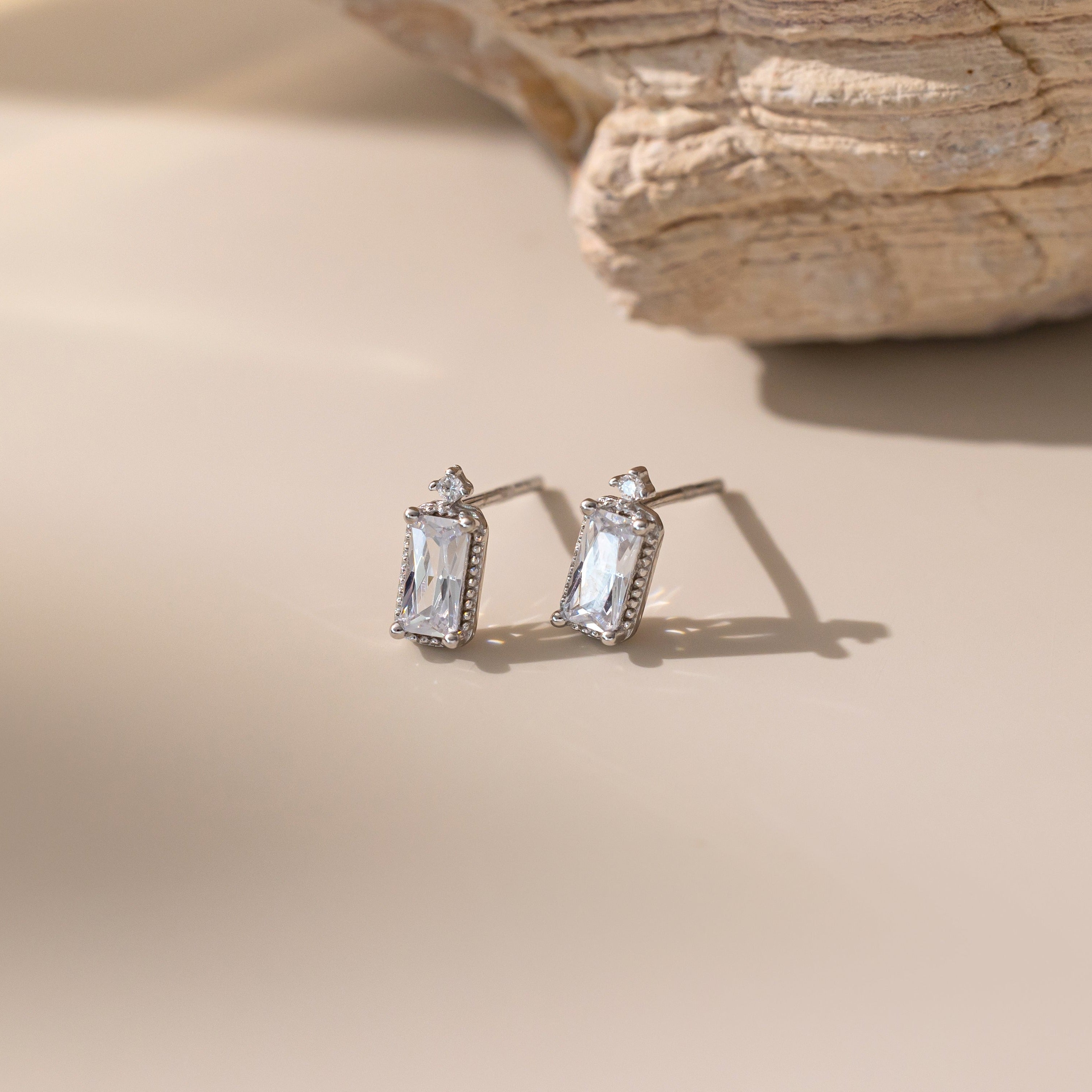 Emerald Cut Diamond Stud Earrings in silver