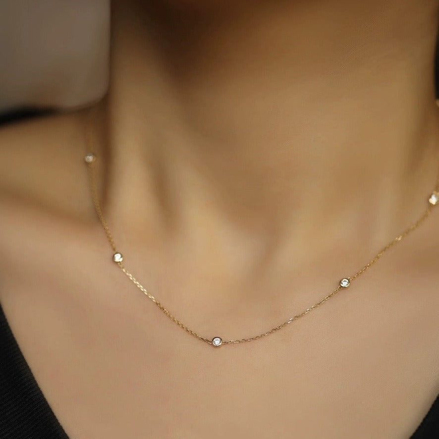 STMG Minimalist Diamond Necklace in gold on neck