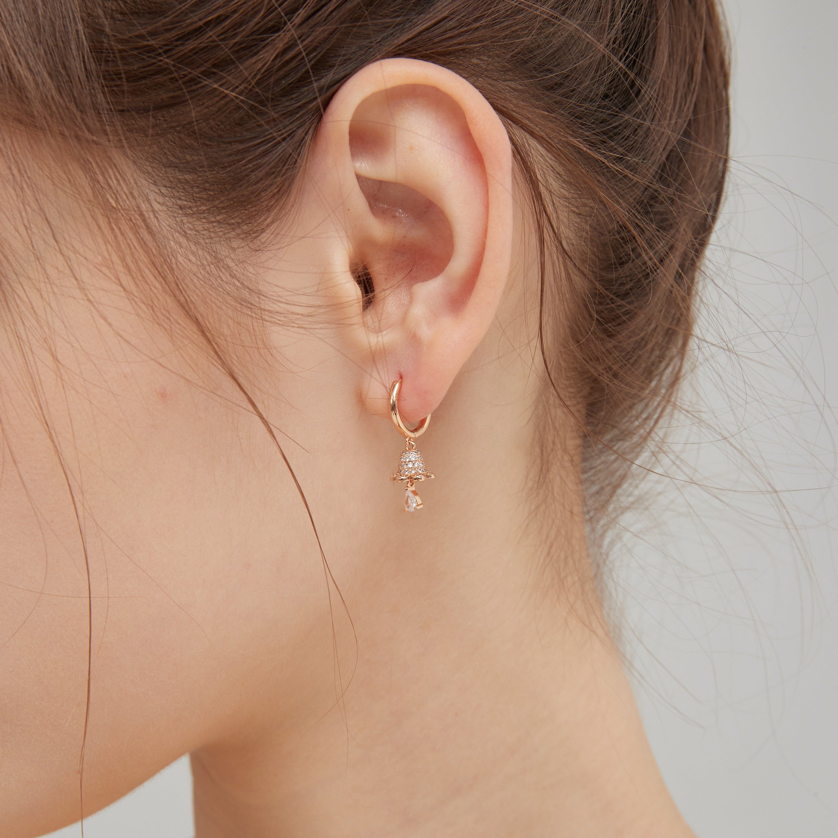 Christmas Bell Hoops in champagne gold on ear