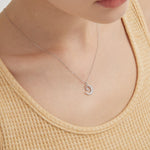 STMG Star on Crescent Moon Necklace  in silver on neck