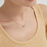 STMG Tiny Sun and Moon Necklace in silver on neck