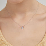 STMG Tiny Sun and Moon Necklace in silver on neck