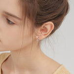 Bowknot Dangle Star Hoops in silver on ear