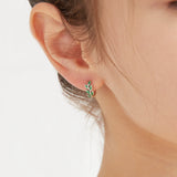 STMG Green Olive Leaf Hoops in gold on ear