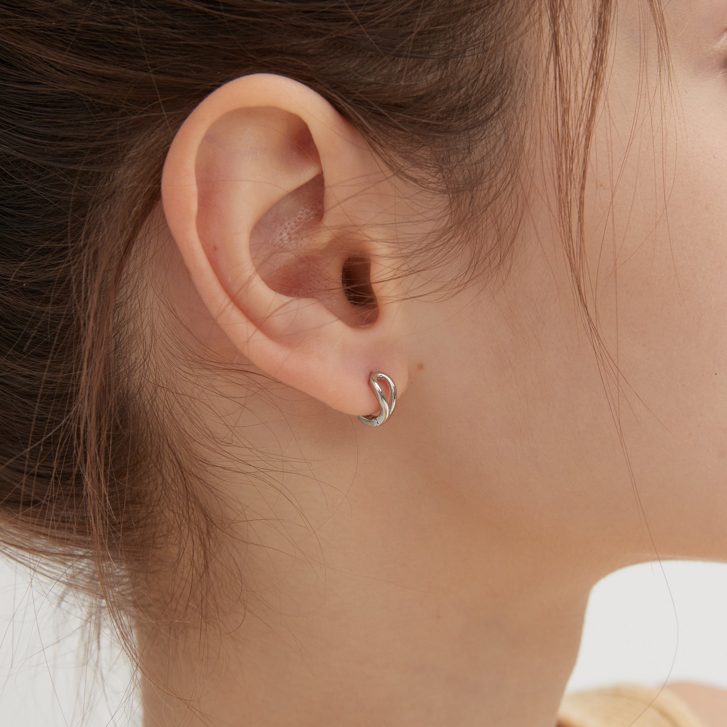 Geometric Droplet Hoops in silver on ear