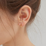 Geometric Droplet Hoops in gold on ear