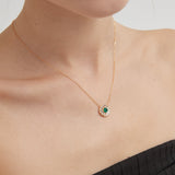 STMG Green Emerald Sun Disk Necklace on neck