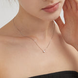 STMG Minimalist Star Necklace on neck