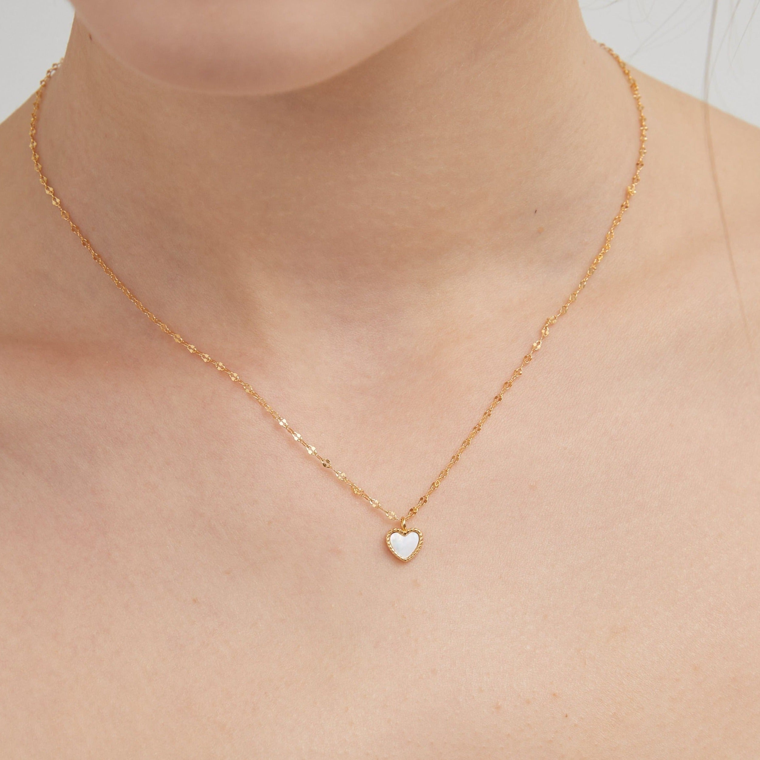 STMG Natural Mother of Pearl Heart Necklace on neck