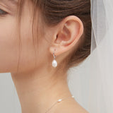 STMG Natural Pearl Dangle Hoops in silver on ear