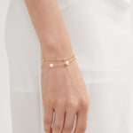 Duo Layer Natural Pearl Bracelet in gold on hand