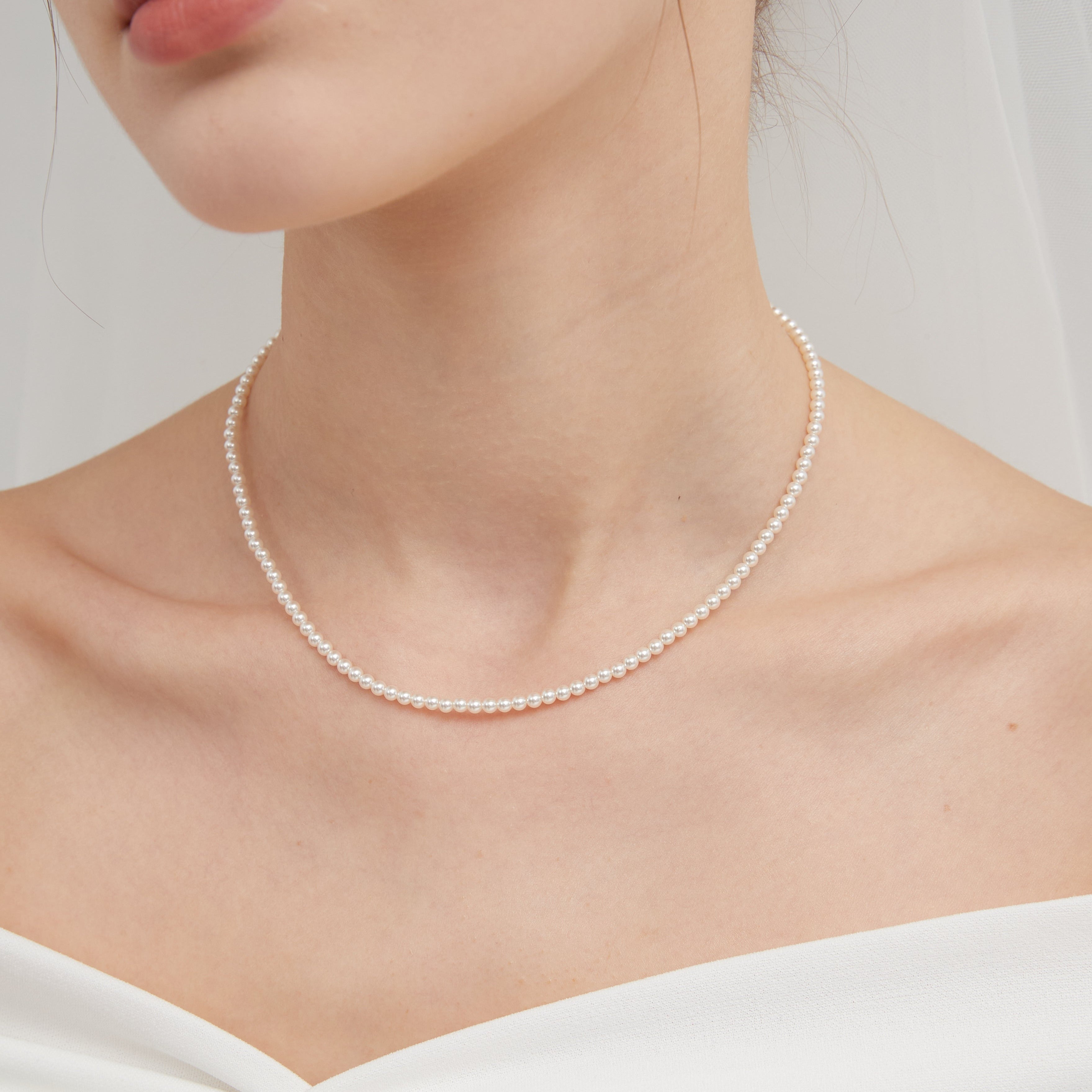 STMG Pearl Choker Necklace on neck