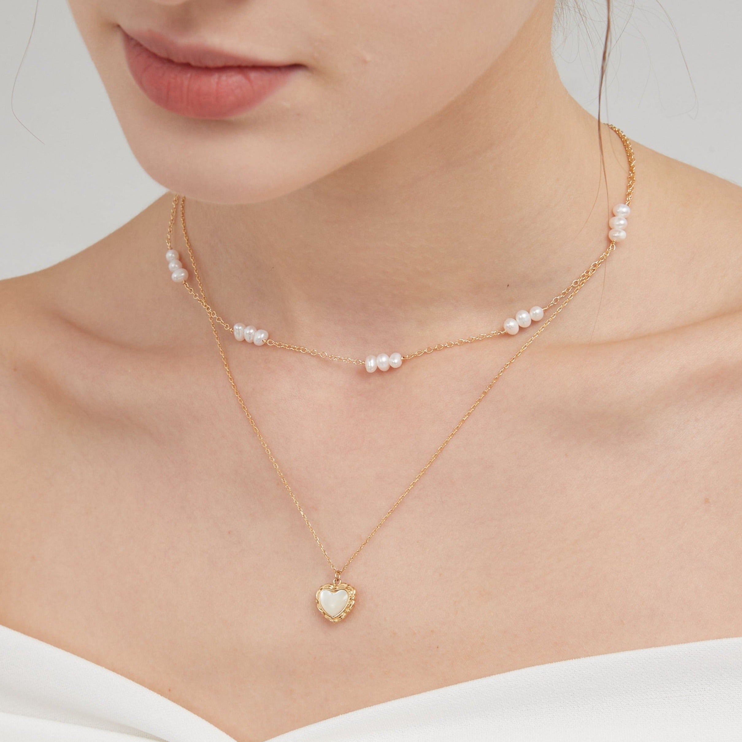 STMG Natural Mother of Pearl Heart Necklace on neck