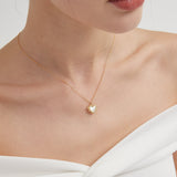 STMG Natural Mother of Pearl Heart Necklace on neck