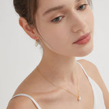 STMG Natural Pearl Dangle Hoops in gold with matching necklace on neck