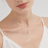 STMG Natural Mother of Pearl Heart Necklace on neck