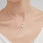 STMG Natural Mother of Pearl Heart Necklace on neck