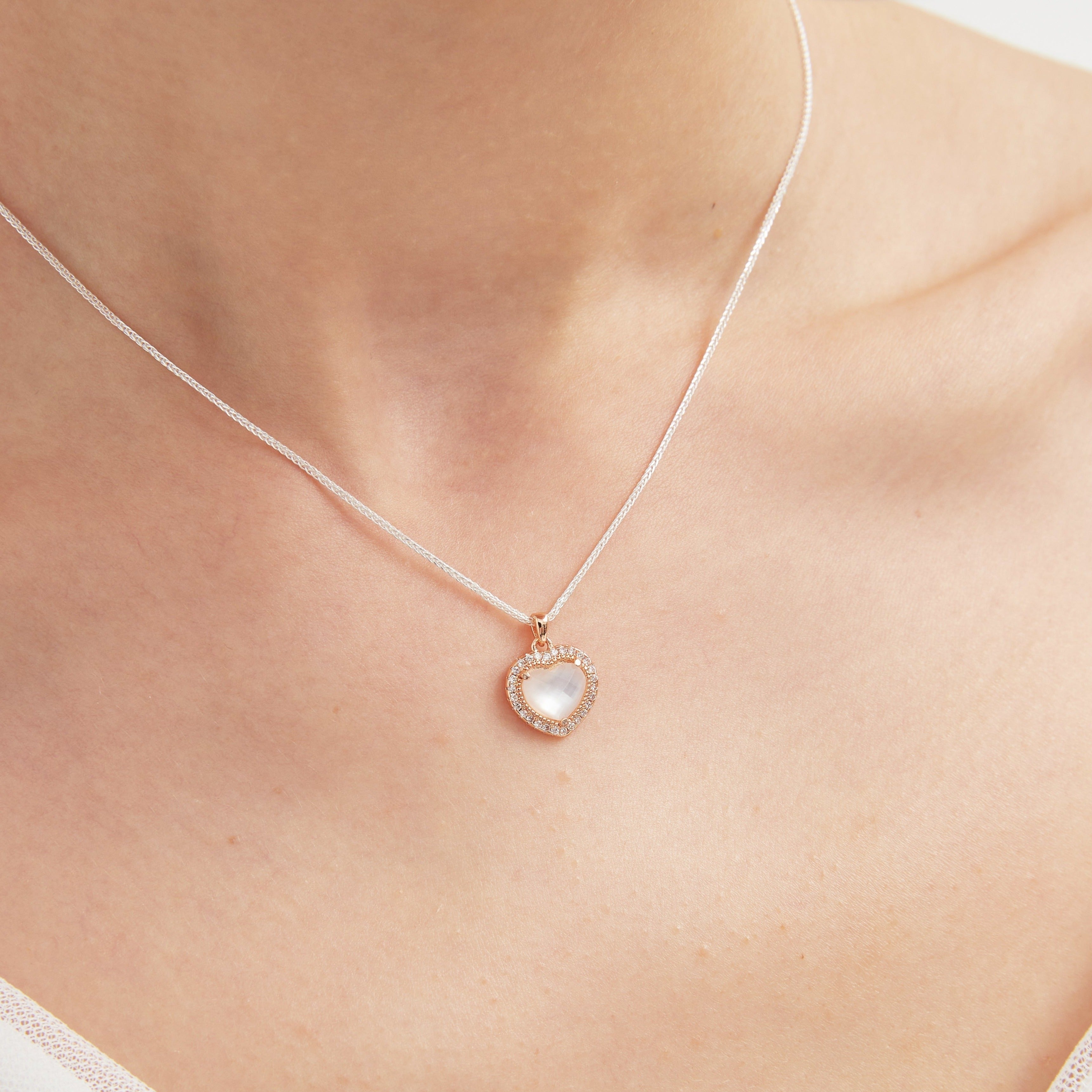 STMG Natural Mother of Pearl Heart Necklace on neck