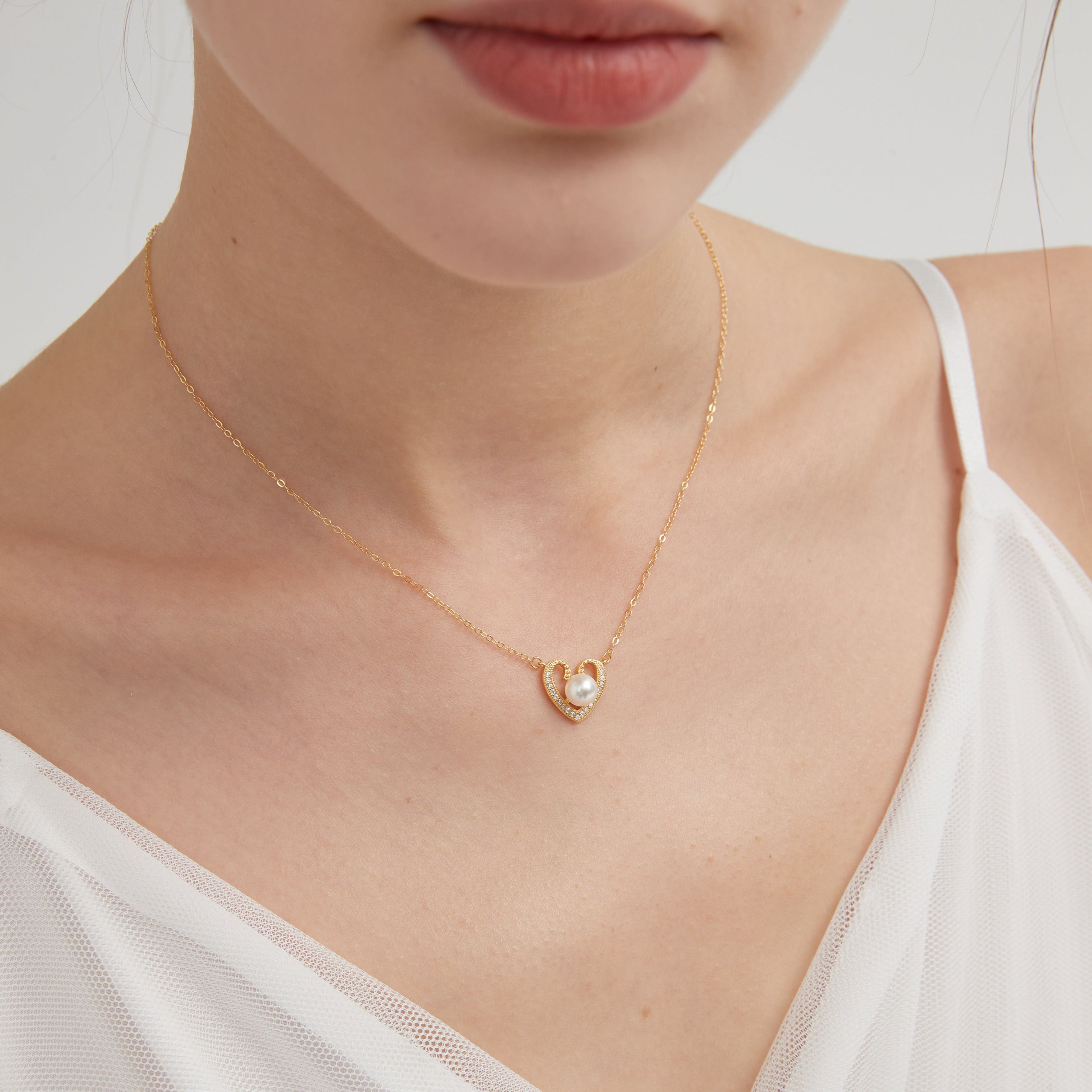 STMG Pearl Heart Necklace on neck