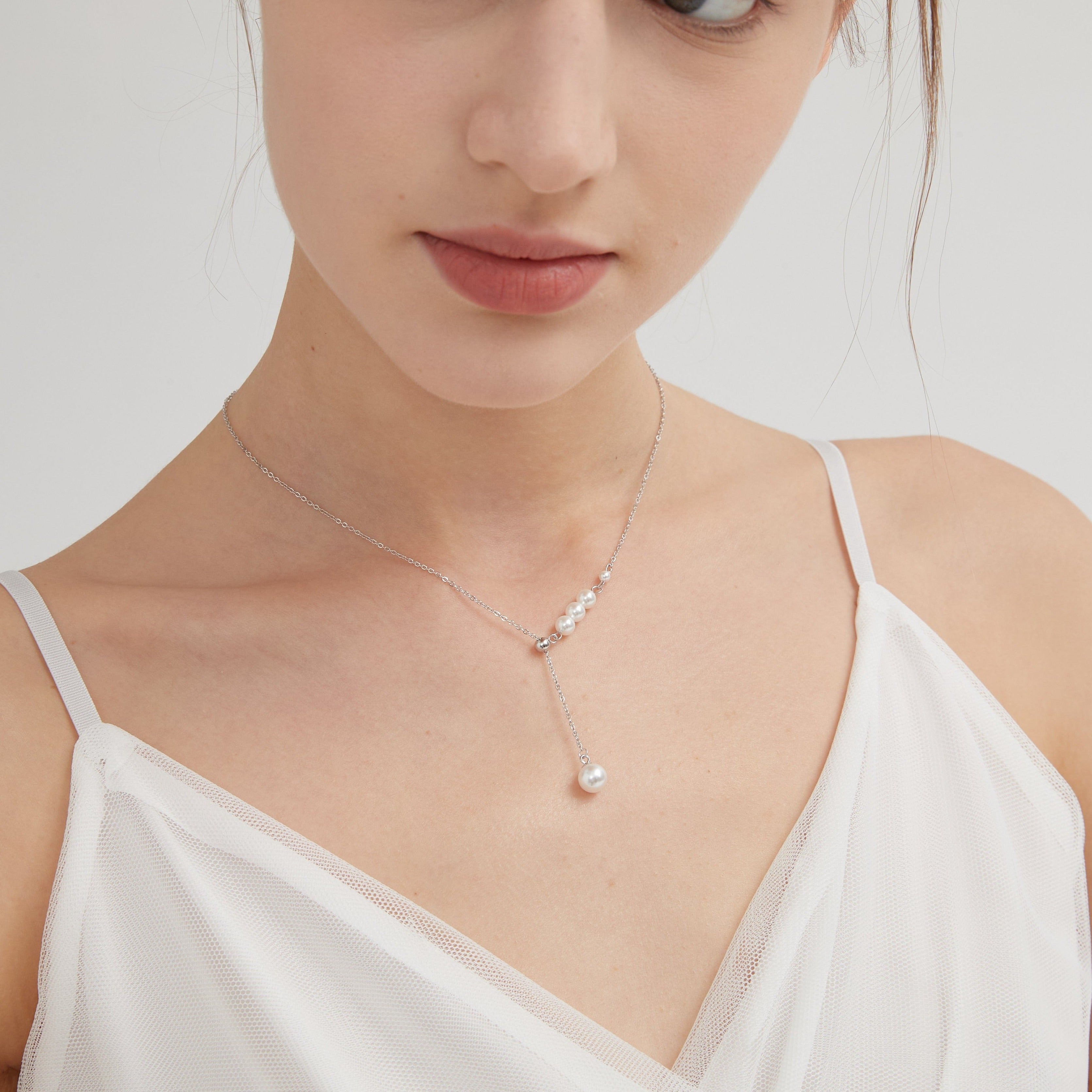 STMG Pearl Necklace in silver on neck