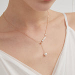 STMG Pearl Necklace on neck