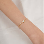 STMG Star with Pearl Bracelet on hand