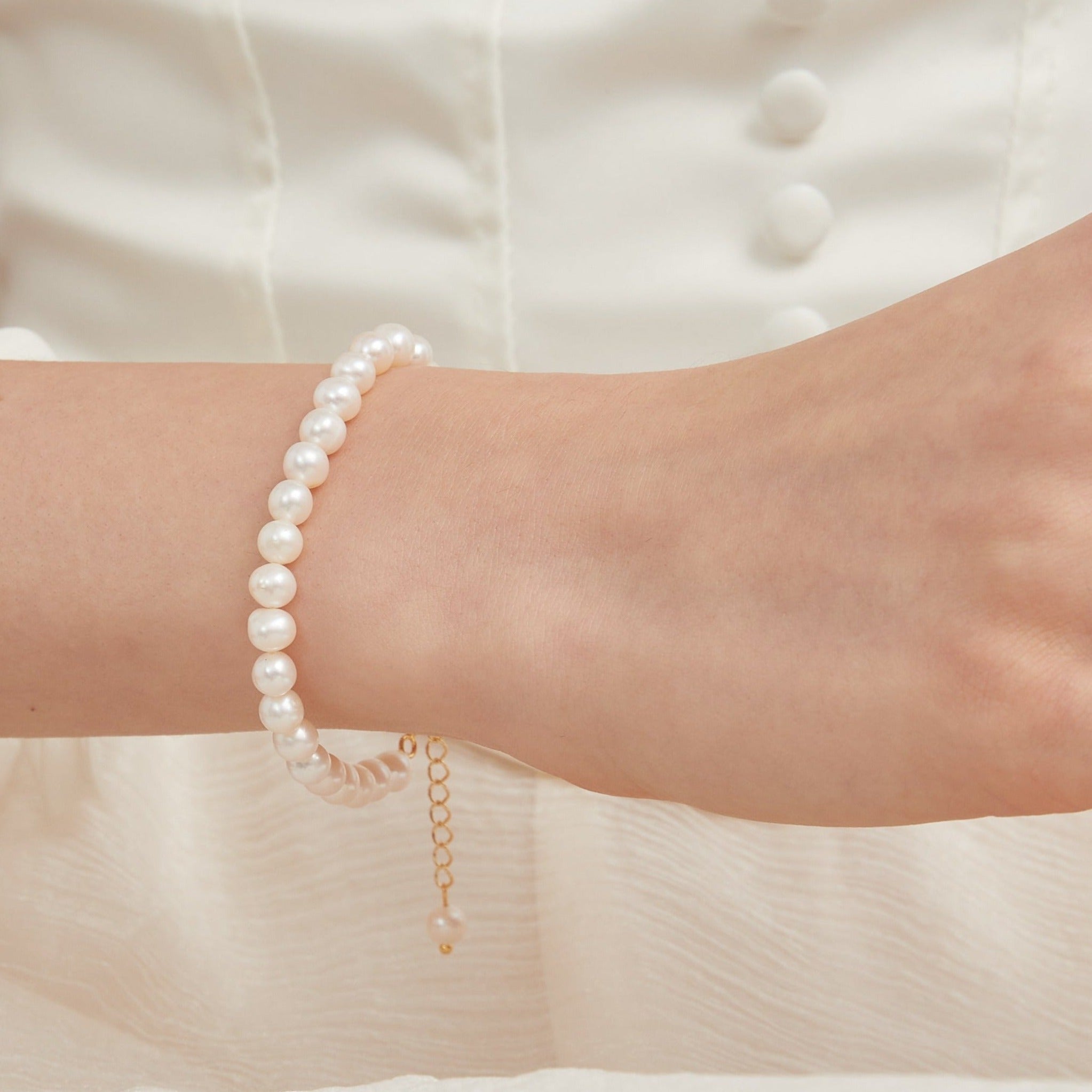 STMG Natural Pearl Adjustable Bracelet on hand