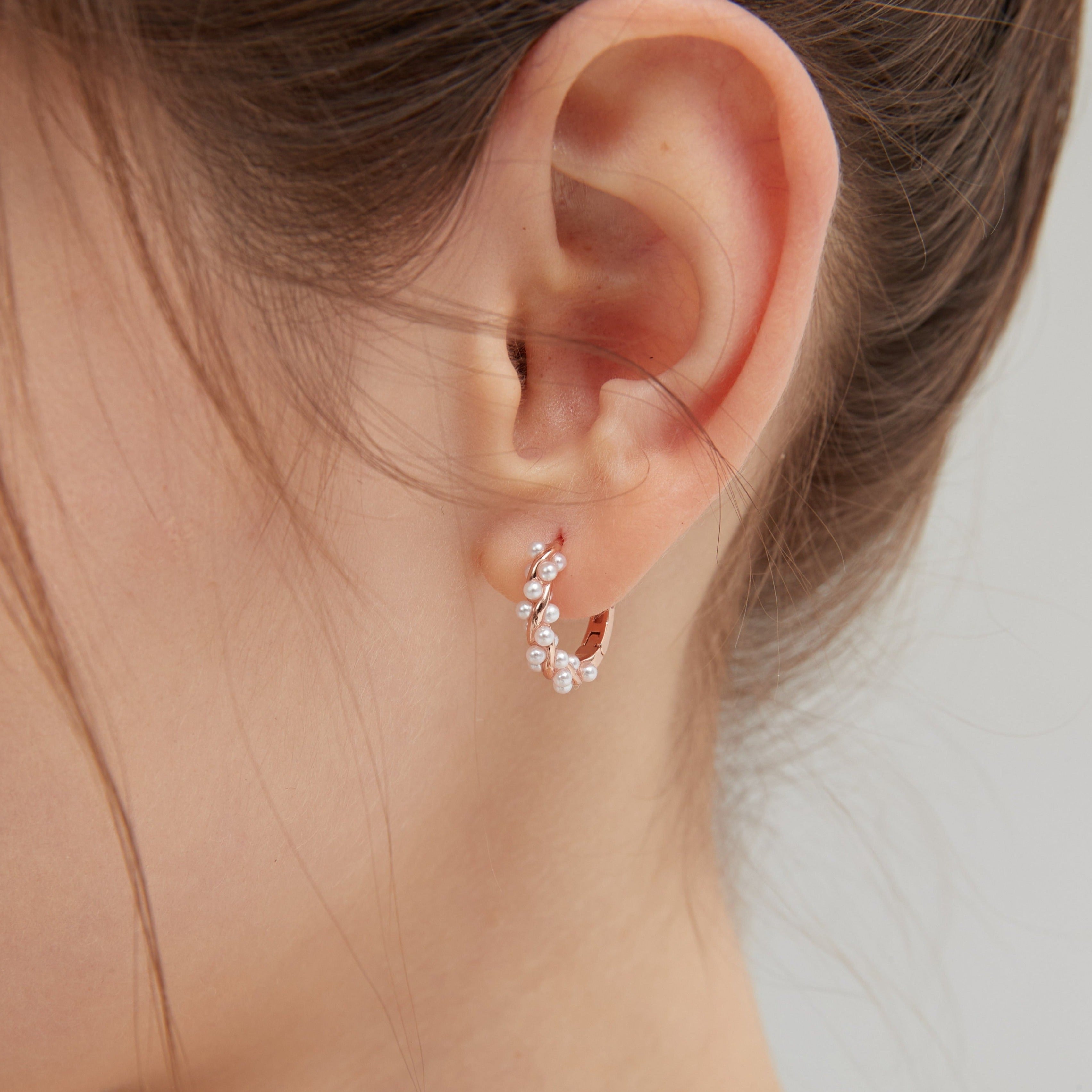 STMG Pearl Wreath Hoops in rose gold on ear