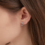 Angel Wing Hoops in silver on ear