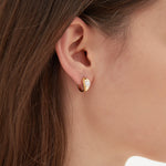 STMG Pearl Hoops on ear