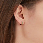 STMG Green Emerald Hoops in gold on ear