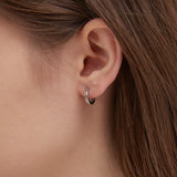 STMG Roman Numeral Hoops in silver on ear