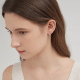 STMG Minimalist Diamond Stud Earrings in gold on ear