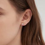 STMG Moonstone Stud Earrings in champagne gold on ear