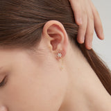 Bauhinia Dangle Earrings on ear