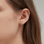 STMG Tiny Crown Stud Earrings in silver on ear