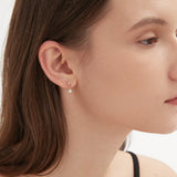 STMG Minimalist Hook Earrings in gold on ear