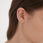 STMG Tiny Opal Starburst Earrings on ear