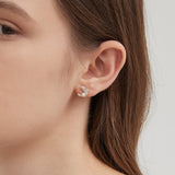 STMG Pearl Crescent Moon Stud Earrings on ear