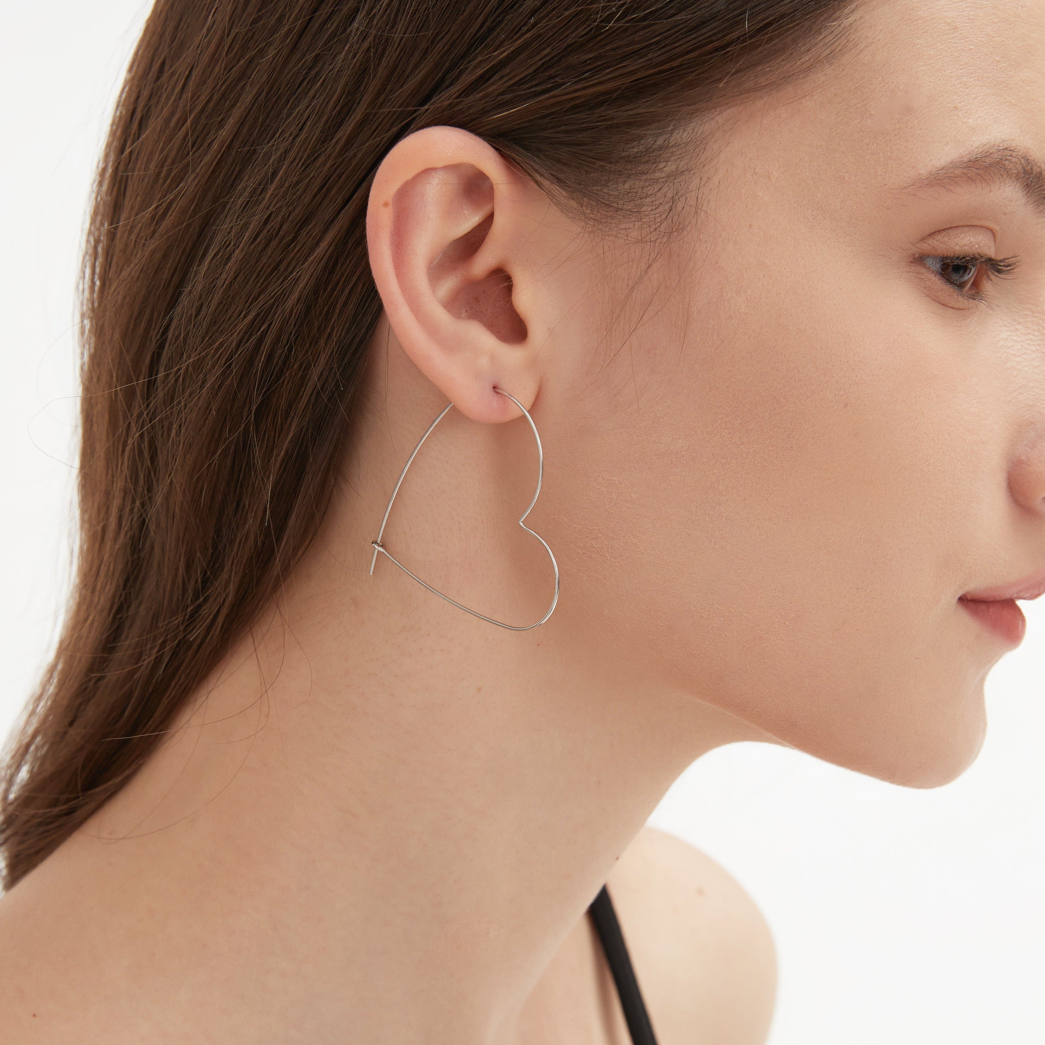 STMG Heart Contour Hoops on ear