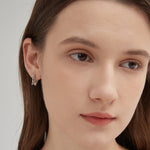 STMG Minimalist Butterfly Hoops on ear